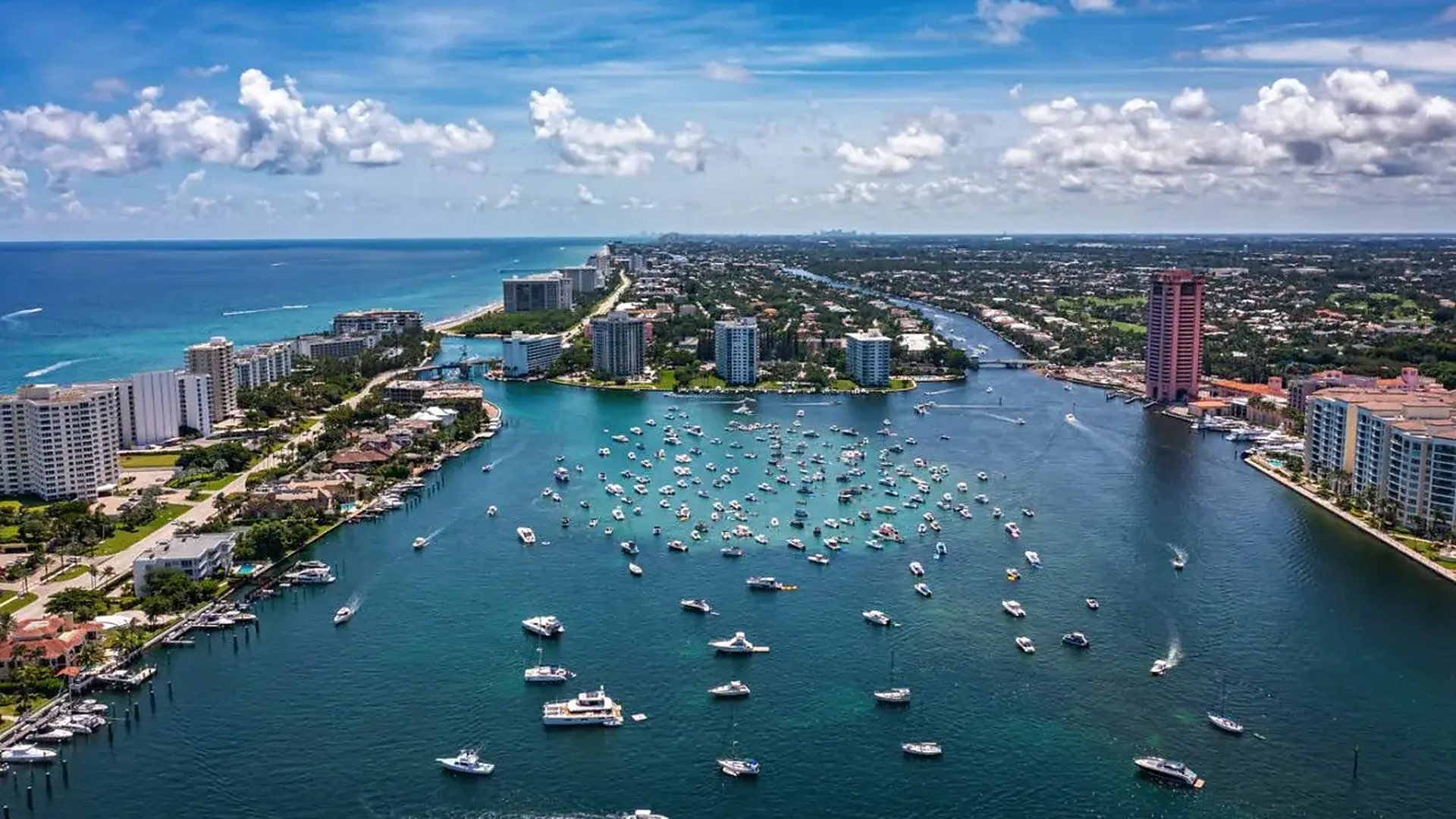 Aerial view of the Intracoastal Waterway at Delray Beach, with the barrier island and Atlantic Ocean at left and the mainland and downtown at right